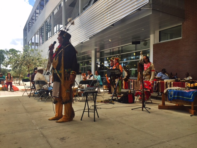 Dave WhiteWolf, a flutist and historian, was a storyteller during the celebration. Students and others leaned in close to hear Native American tales.

Photo by Rachel Cazares