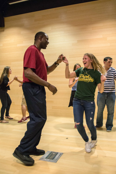 Students rehearse a dance together before salsa instructor Andres Espinosa turns on the corresponding song. Photo by Courtney Stringfellow
