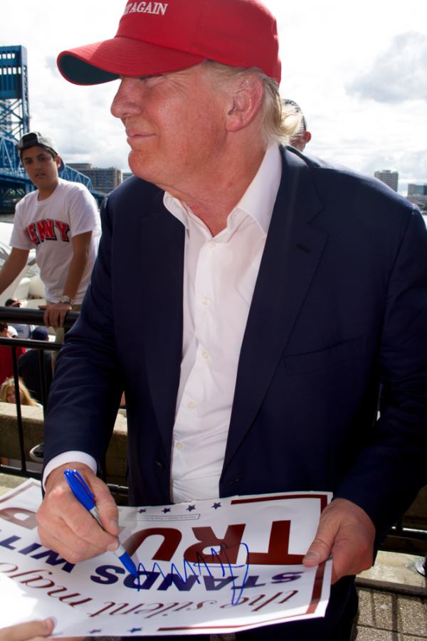 Donald Trump signs autographs for fans at the end of the rally last October at The Landing. Photo by Kristen Smith
