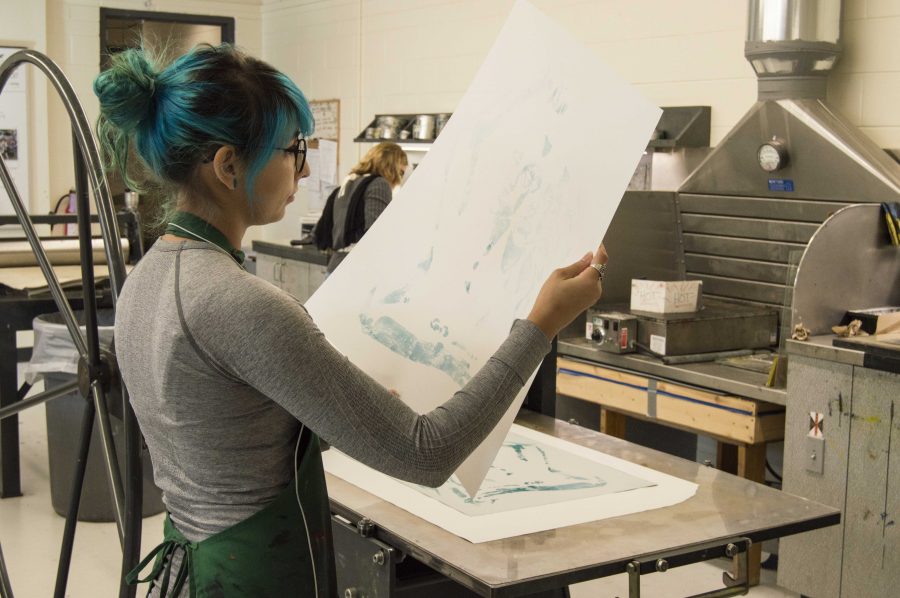 Brittany Gorelick works on a printmaking project in the Fine Arts Building. Printmaking classes are offered through the Art and Design Department. 

Photo by Cassidy Alexander