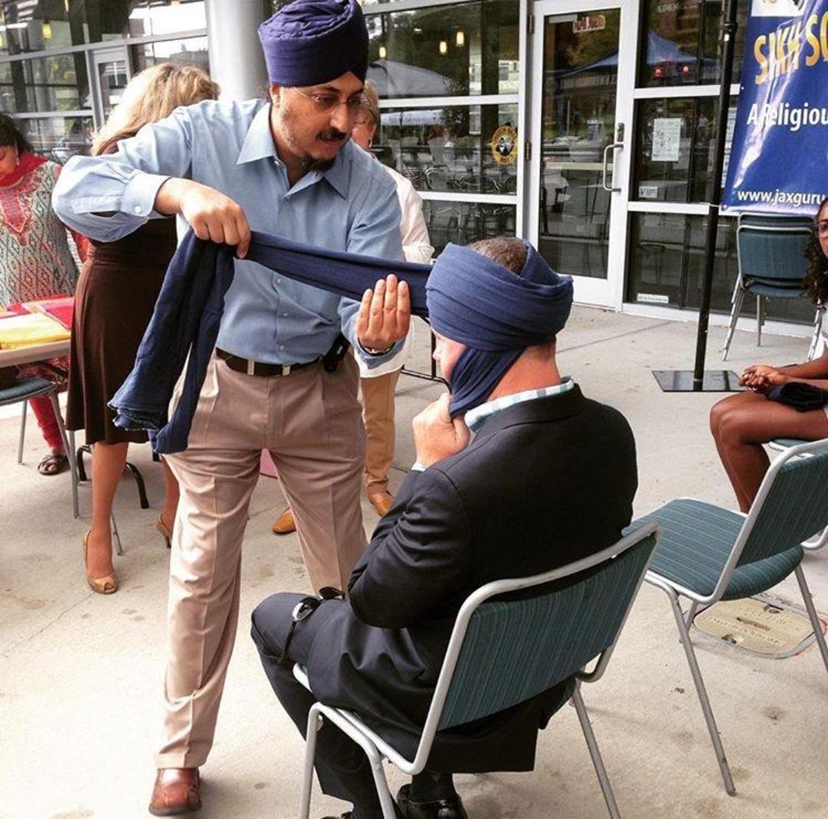 Wrapping turban.  Photo courtesy of @uofnorthflorida on Instagram