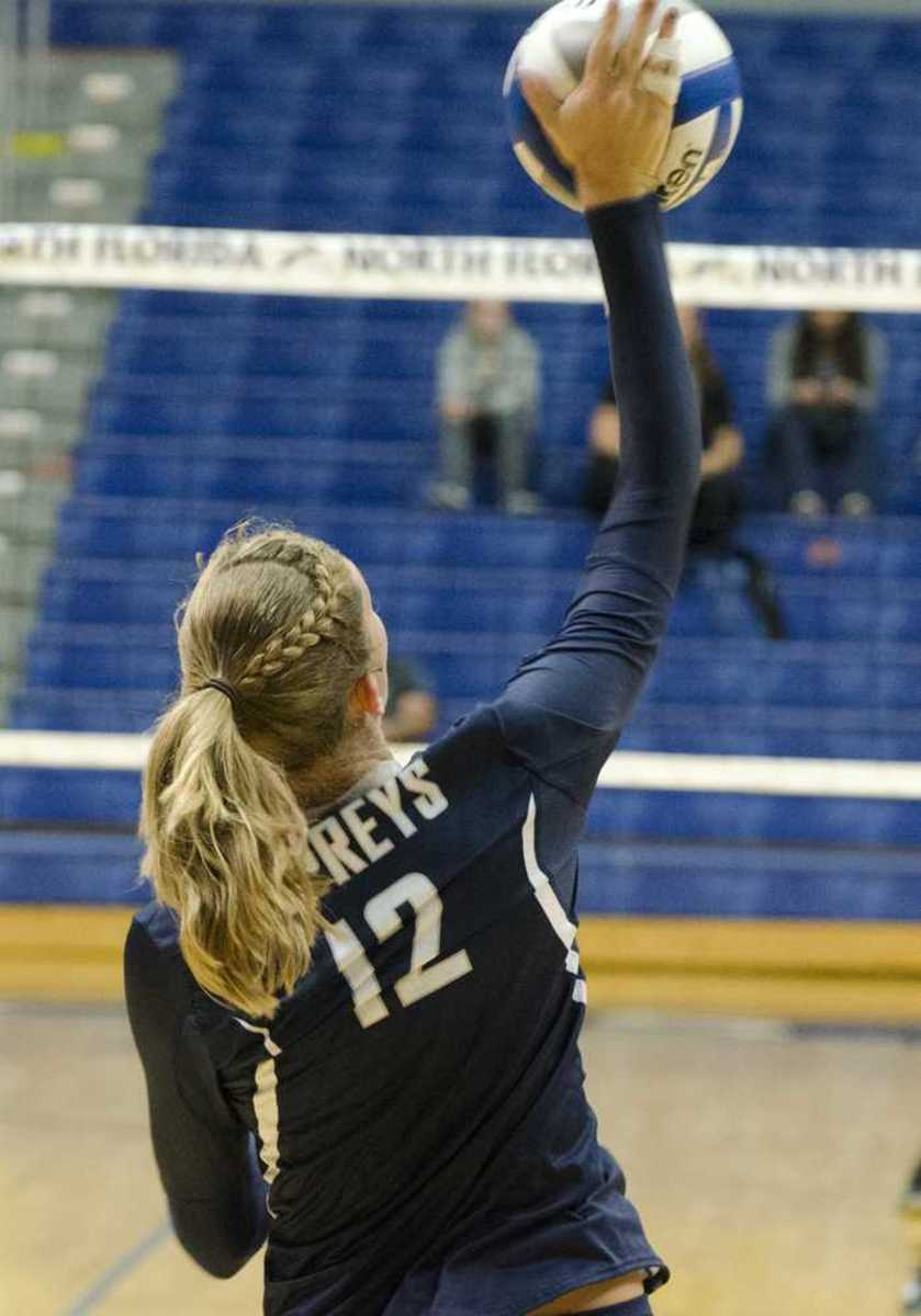 Junior Morgan Van Alstine sets to serve. Photo by Ashley Saldana.