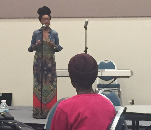 Marissa Young performs spoken word to a captivated audience. Photo by Rachel Cazares,/i>