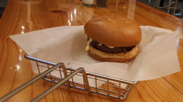 The Philly Burger features Epik Burger’s beef patty topped with house made cheese sauce, sauted mushrooms, onions and peppers. Photo by Courtney Stringfellow. 