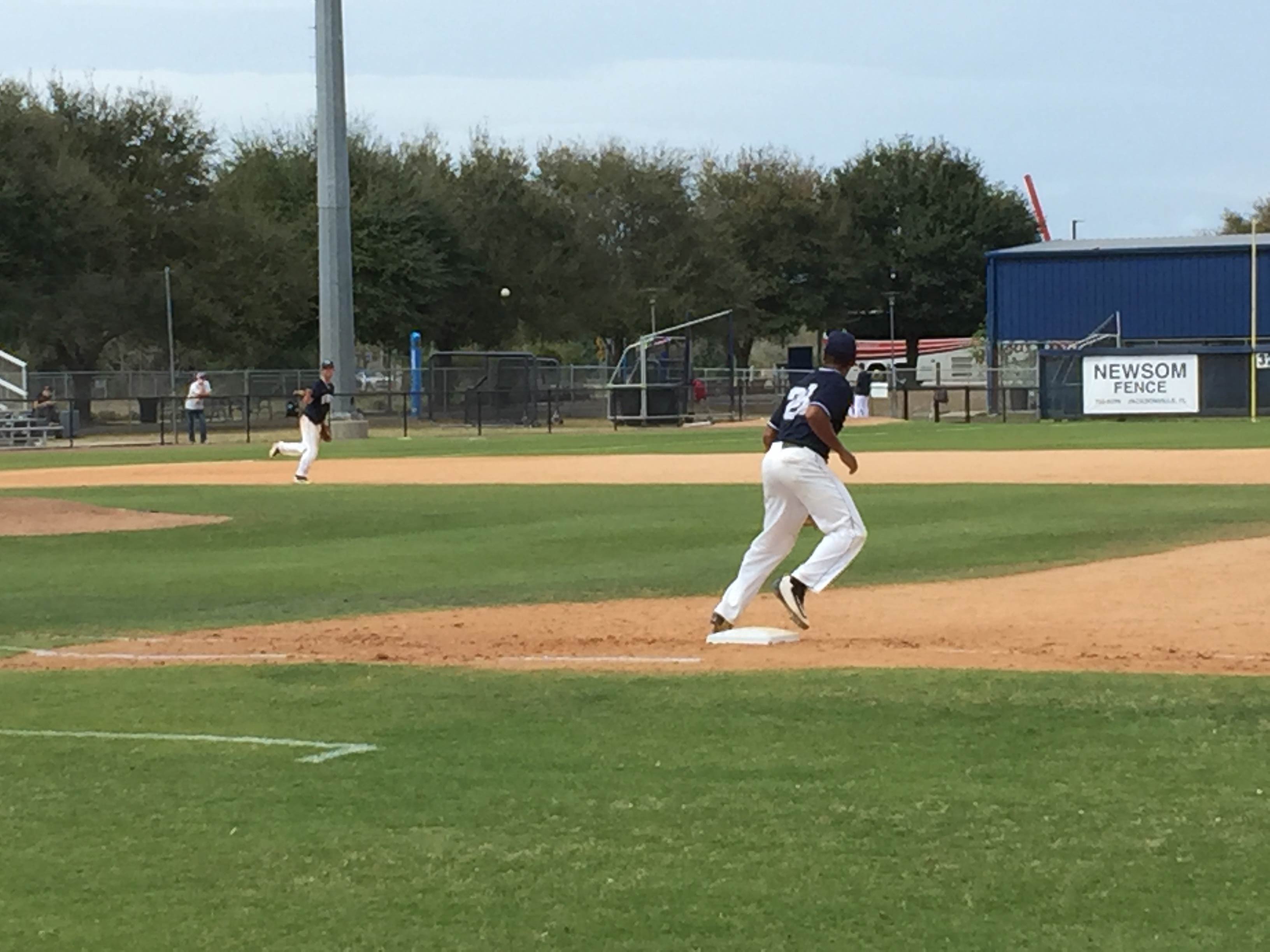 Christian Diaz stretches to catch a throw from 3B Alex Merritt.

Photo by Will Weber