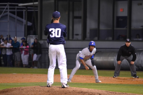 Austin Drury stares down Gator speedster Buddy Reed. Photo by Emily Woodbury