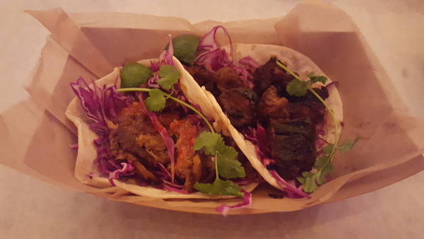 The carnitas (left) and the sour cherry tenderloin asada are stuffed with juicy pulled pork and chopped tenderloin. Photo by Courtney Stringfellow. 