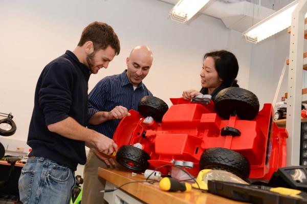 Dr. Juan Aceros and students with one of the adaptive toys cars. (Courtesy of Joanna Norris) 