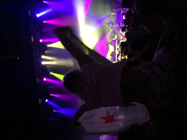 An attendee sitting on the shoulder of another fan, getting the perfect view for the collaboration of GRiZ and Lettuce. Photo by Patrick Grabowski. 