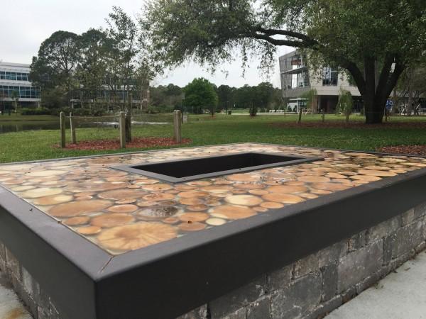 Bench made of iron, kiln-dried wood and resin. Photo by Tiffany Butler