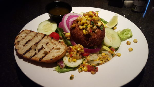 The Crab Cake Salad's mixture of fresh peppers, grilled corn and other vegetables transform a simple salad into a satisfying entree. Photo By Courtney Stringfellow.