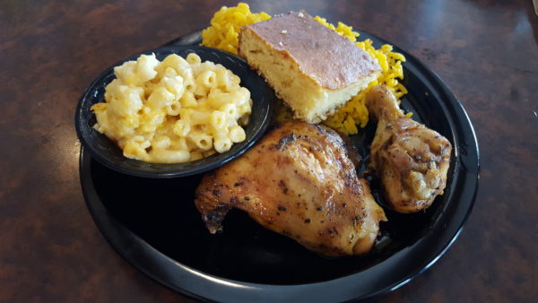 Each plate comes with a customer's choice of juicy meat, two sides and a piece of sweet cornbread. Photo by Courtney Stringfellow.
