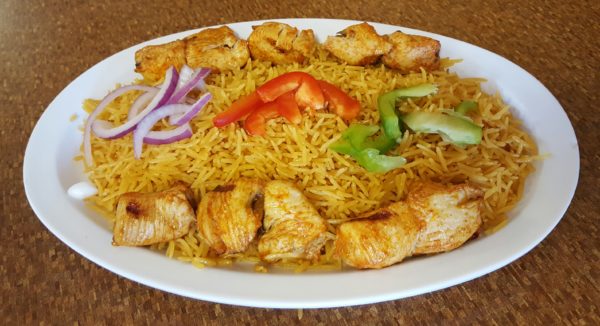 The Chicken Kabob Platter features all of the juicy flavors found on a traditional kabob over a bed of firm yellow rice. Photo by Courtney Stringfellow.