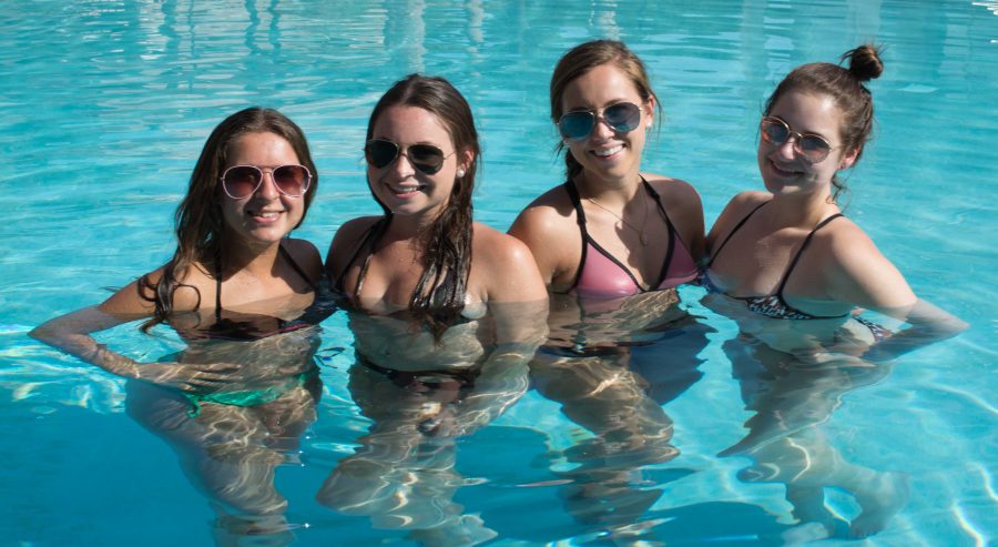 Freshmen+Sydney%2C+Rachael%2C+Bailey%2C+and+Morgan+enjoying+the+Clubhouse+pool.++Photo+by+Lilli+Weinstein