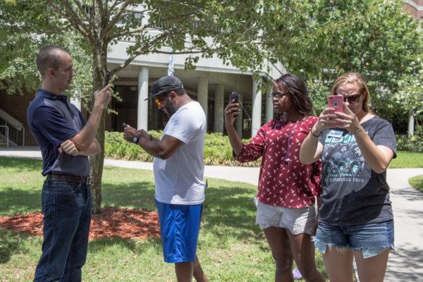 Students play Pokemon Go on campus. Photo by Jenn Mello.