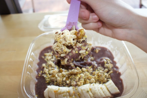 An acai bowl topped with banana and granola. Photo courtesy of Happy Cup.