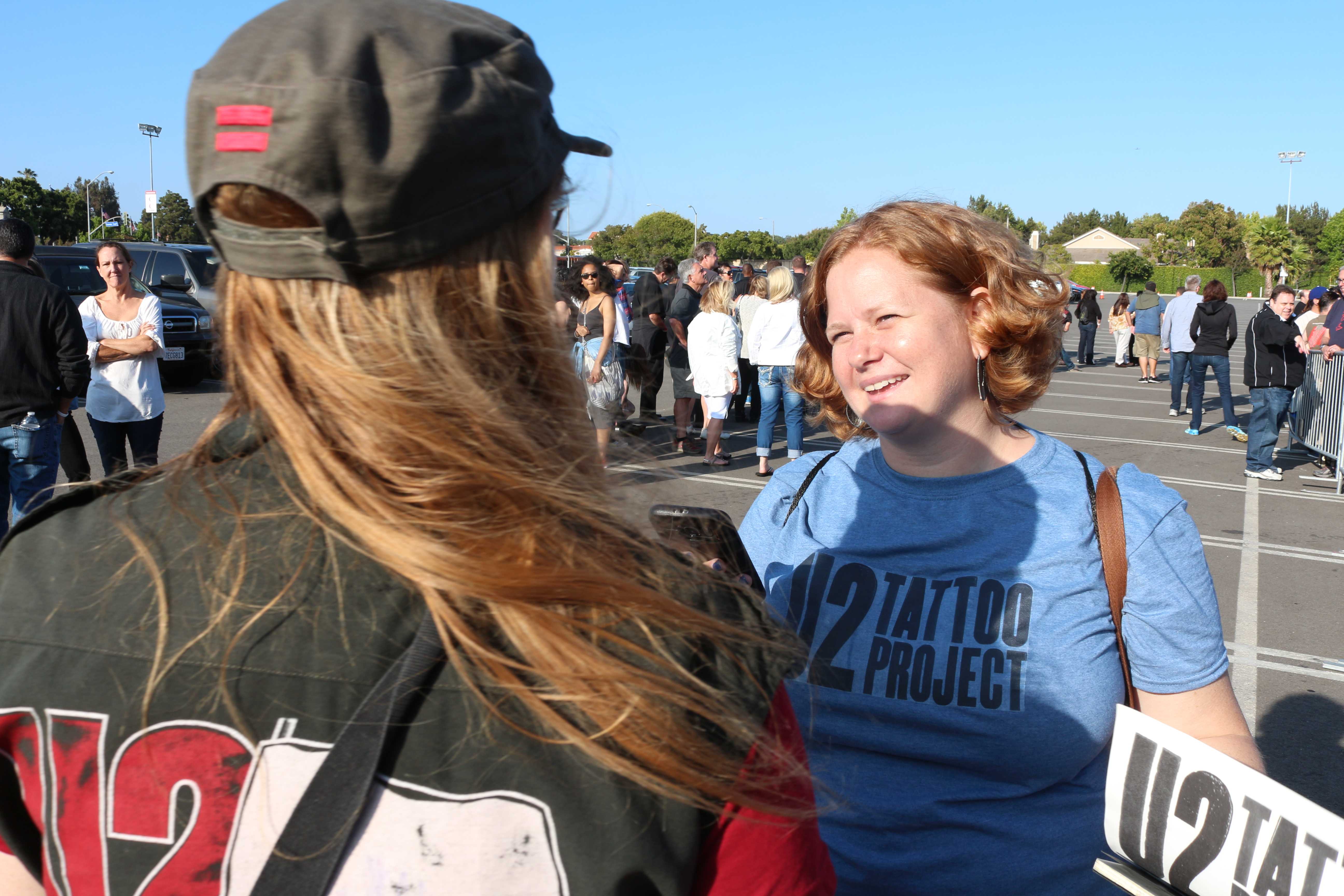 UNF professor Beth Nabi interviews a fan as part of the U2 Tattoo Project. Photo courtesy Chris LeClere