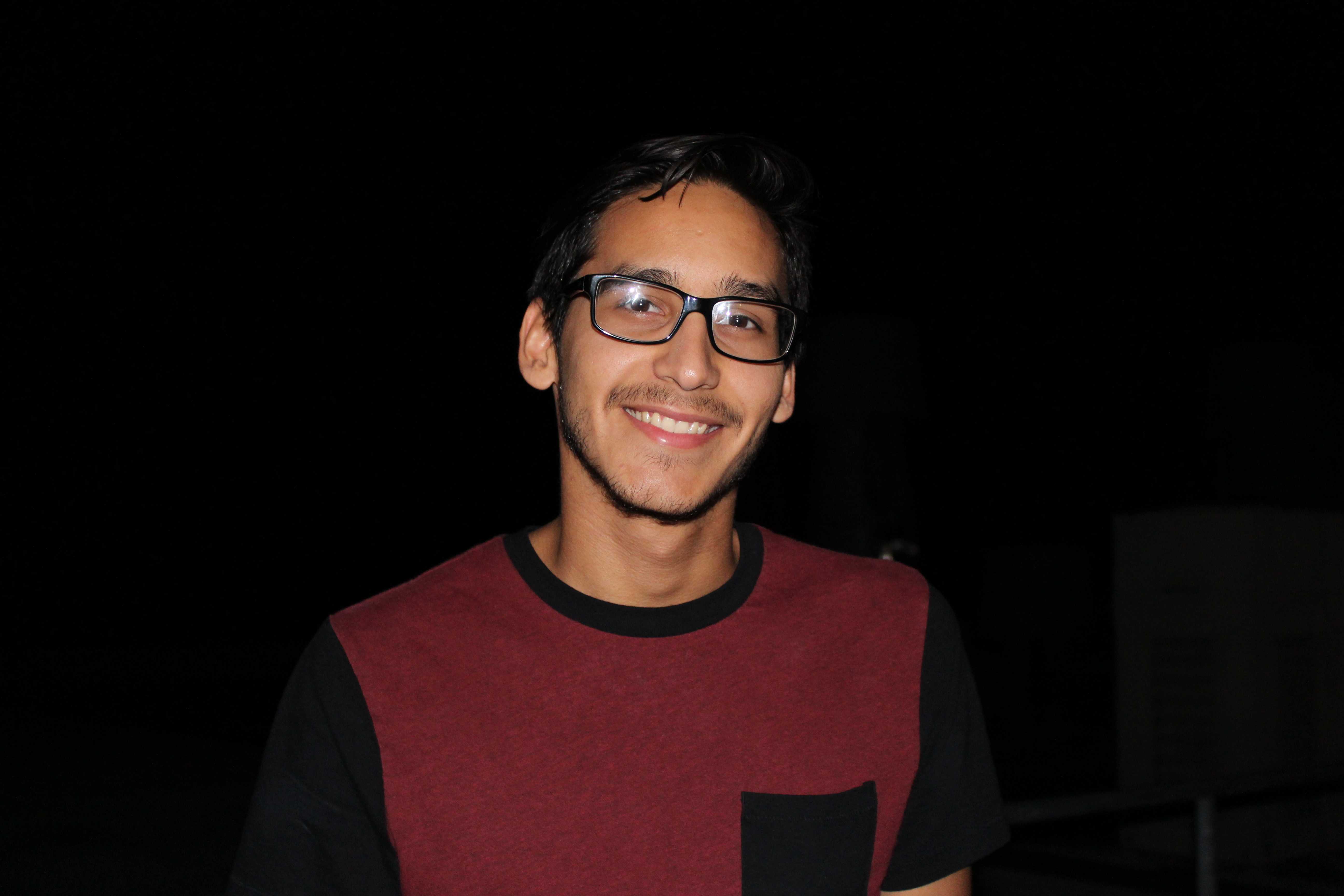 Joel Serrano, a senior studying biochemistry, focuses his own telescope at Astronomy Night. Photo by Ashley Pace