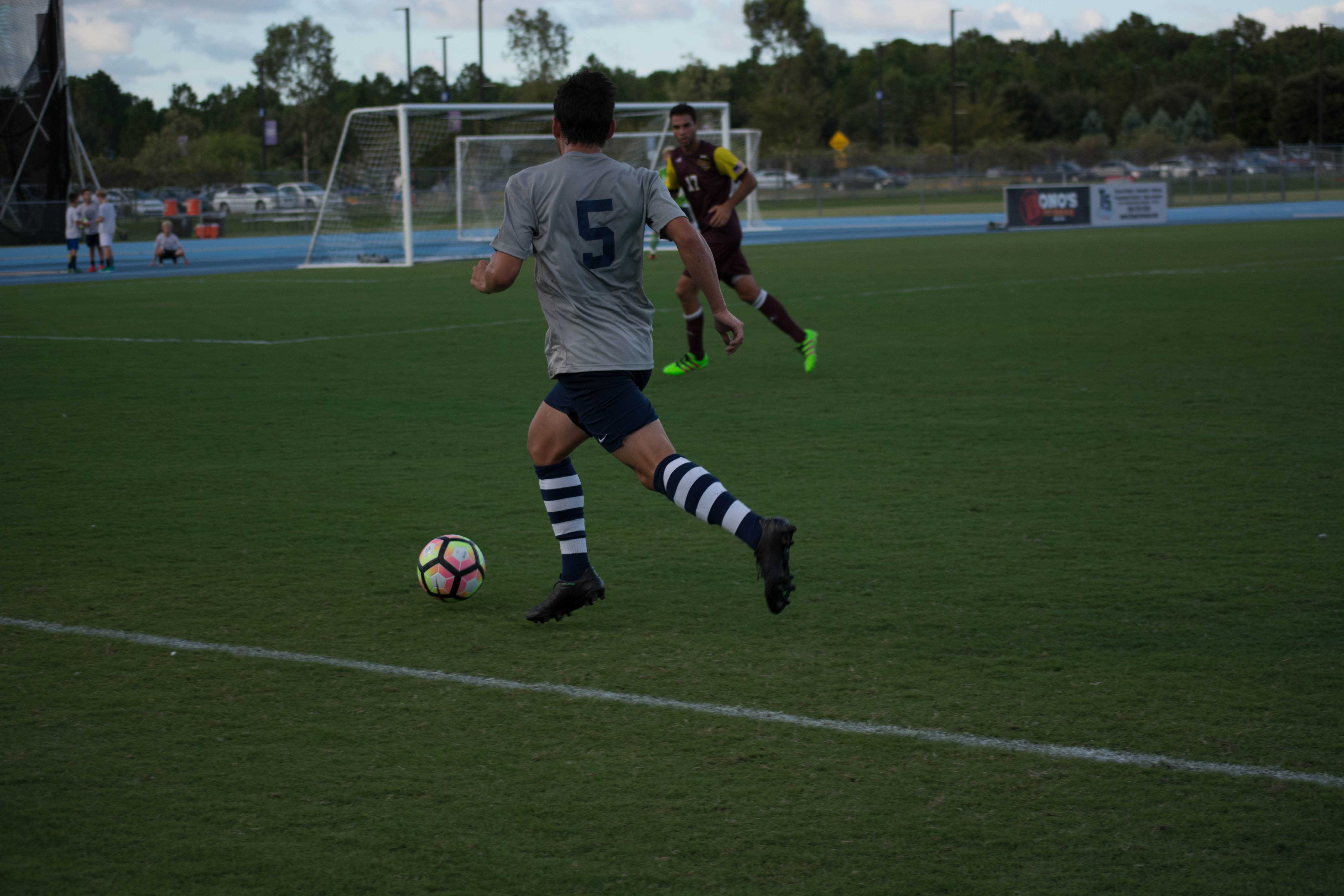 Josh Castellanos dribbles forward against Winthrop.

Photo by Lili Weinstein