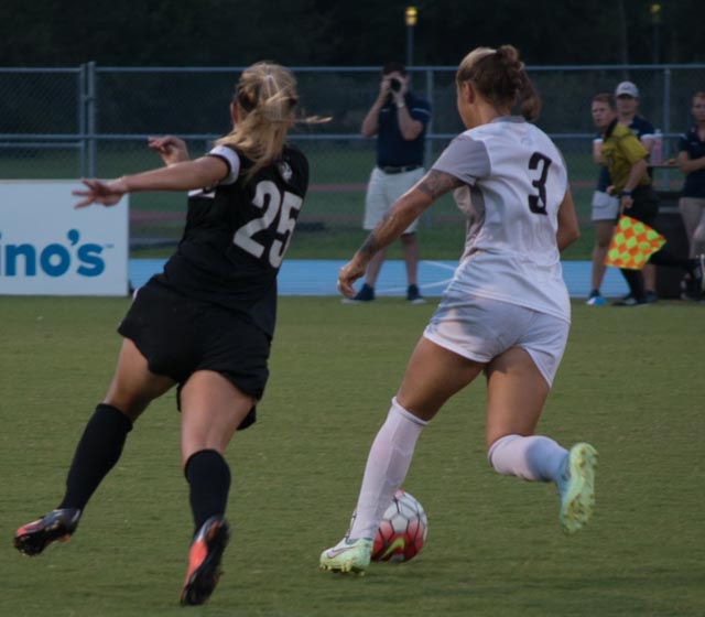 Senior midfielder Alexis Bredeau scores the game-winning goal. Photo by Lilli Weinstein