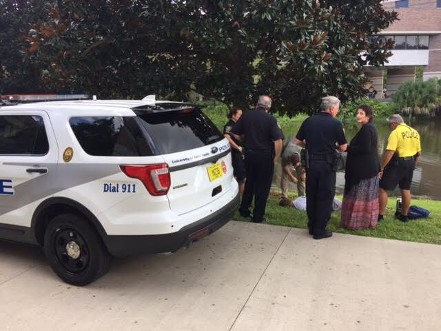 Police handcuffed a man who witnesses say yelled at a student in the library and screamed about ISIS. Photo by Will Weber
