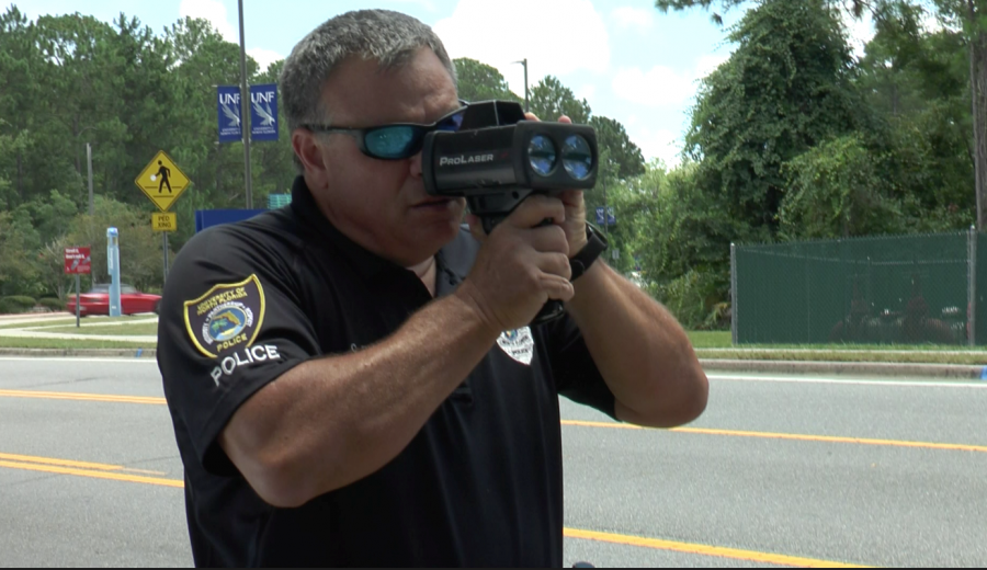 Officers use laser guns to pinpoint the exact speed of a vehicle going through campus. Photo by Alexandra Torres-Perez