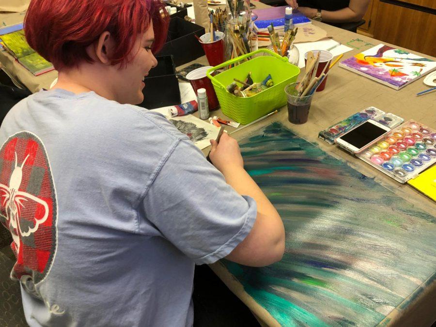 Olivia Hodgson working on art. Photo by Colin McCann.