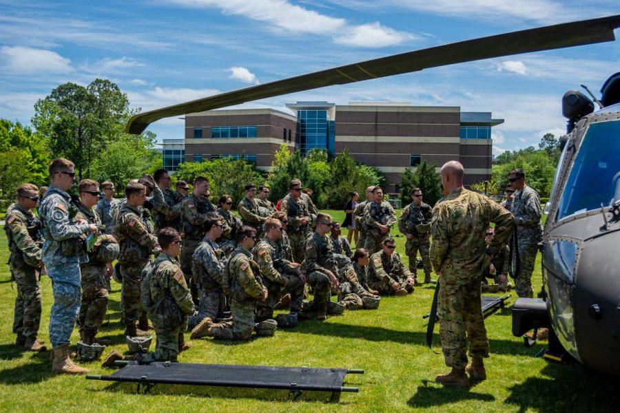 The UNF Army ROTC and the Air National Guard listening to instructions before the drill starts.