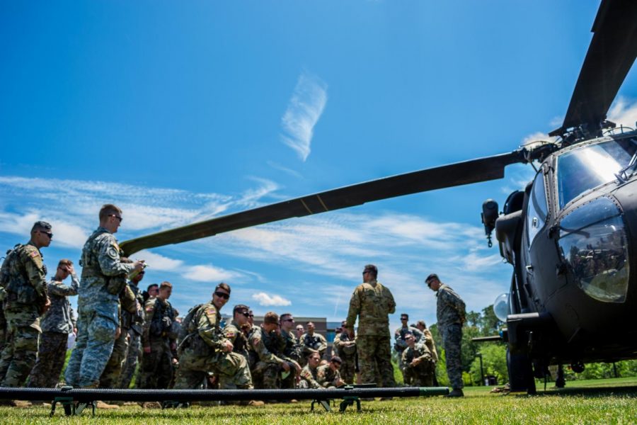 The UNF Army ROTC and the Air National Guard listening to instructions before the drill starts.