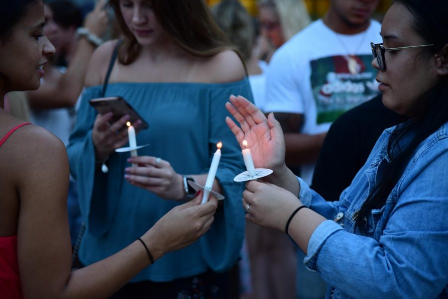 Students come together at a vigil for 20-year-old Hayden Raulerson.
