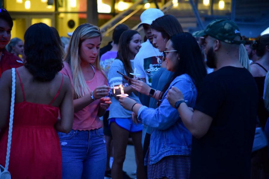 Students come together at a vigil for 20-year-old Hayden Raulerson.