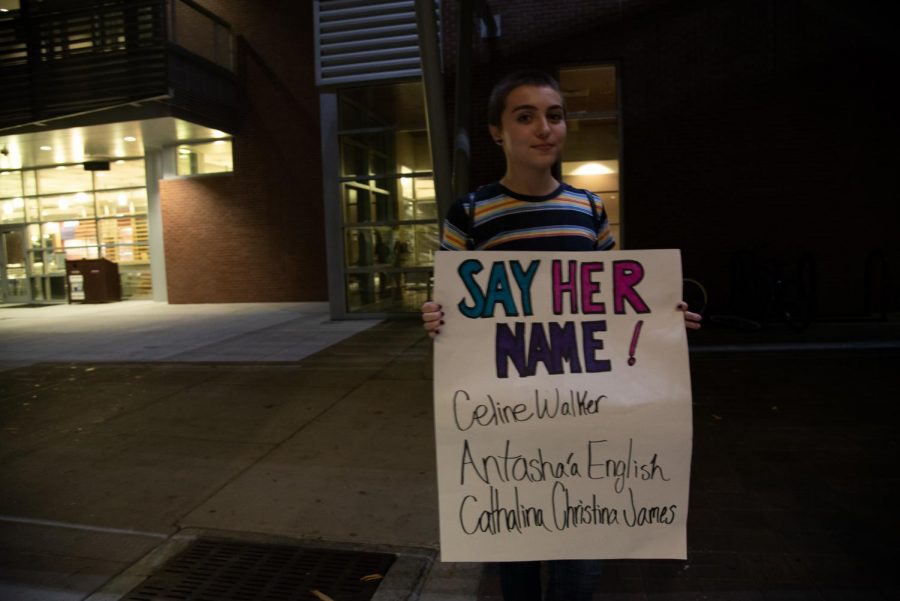 Ezra Benavidez with a sign in support of trans women and men