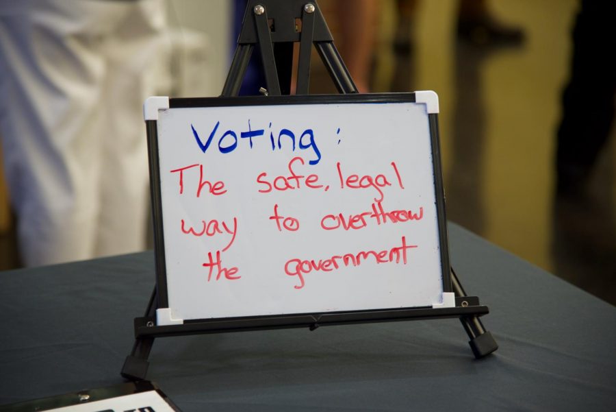 Sign stating "Voting: The safe, legal way to overthrow the government."