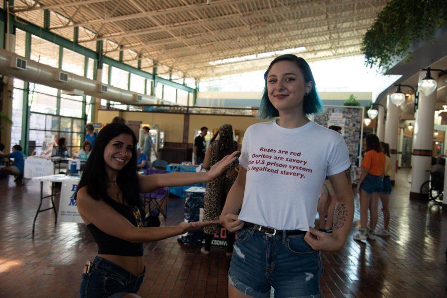Jadyn Duguid, a student of Jacksonville University, wears a shirt that reads, "Roses are red, Doritos are savory, the U.S. prison system is legalized slavery."