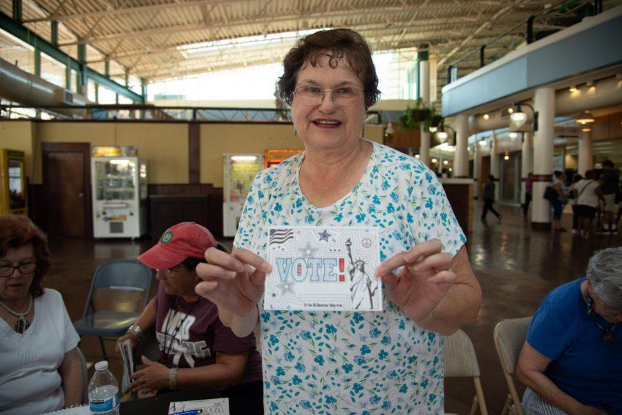 An attendee encourages others to "stamp the vote."