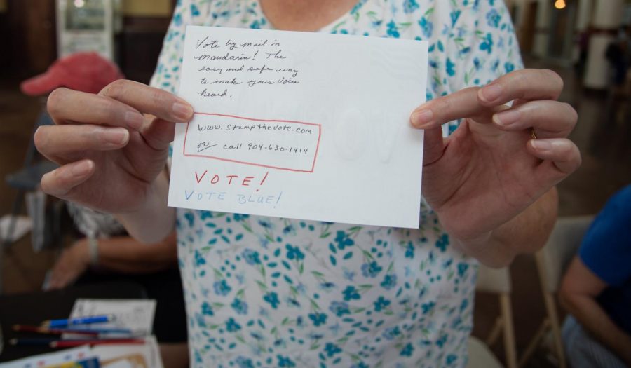 An attendee encourages others to "stamp the vote."