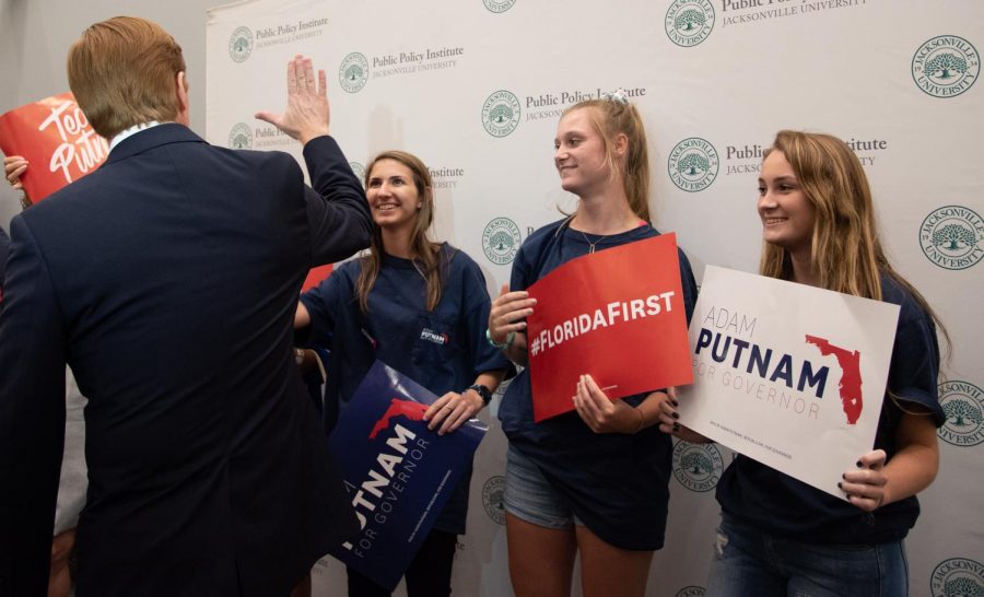 Adam Putnam greets his supporters after a long debate at Jacksonville University.