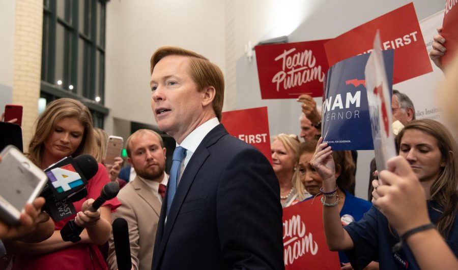 Adam Putnam thinks before answering a press question.
