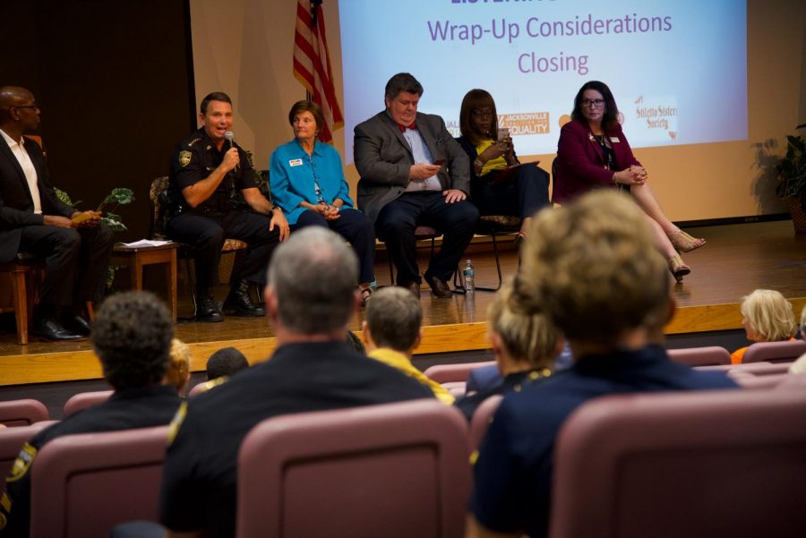 JSO officer and panel responding to questions and concerns, with JSO presence in the forground.