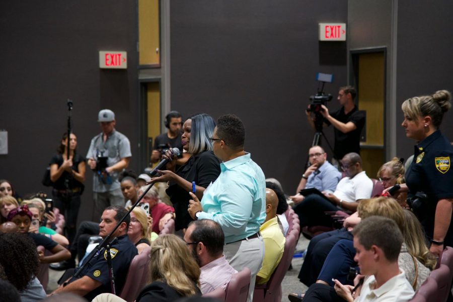 Attendee getting emotional while speaking about a personal traumatic  experience to the panel.