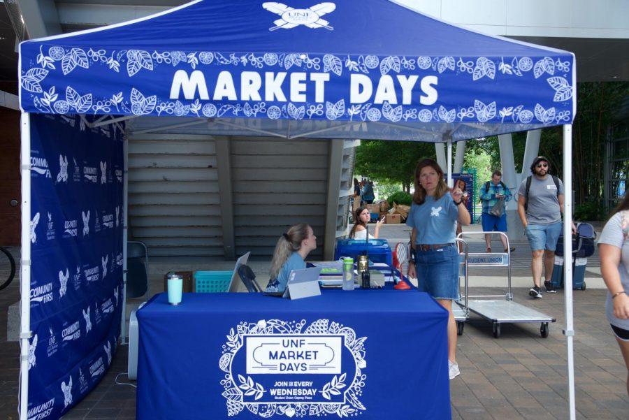 Market day information table and tent.