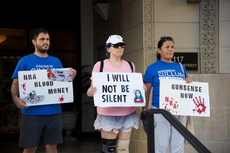 Peaceful protesters display signs.