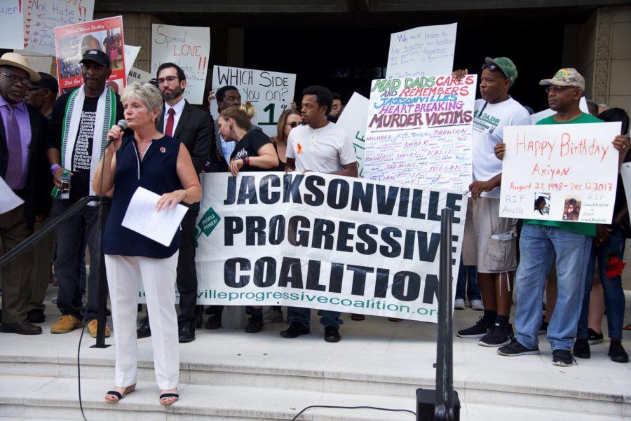 Peaceful protesters display signs.