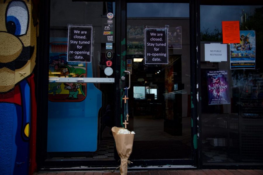 Crosses and flowers placed outside of Chicago Pizza in remembrance of those who lost their lives.