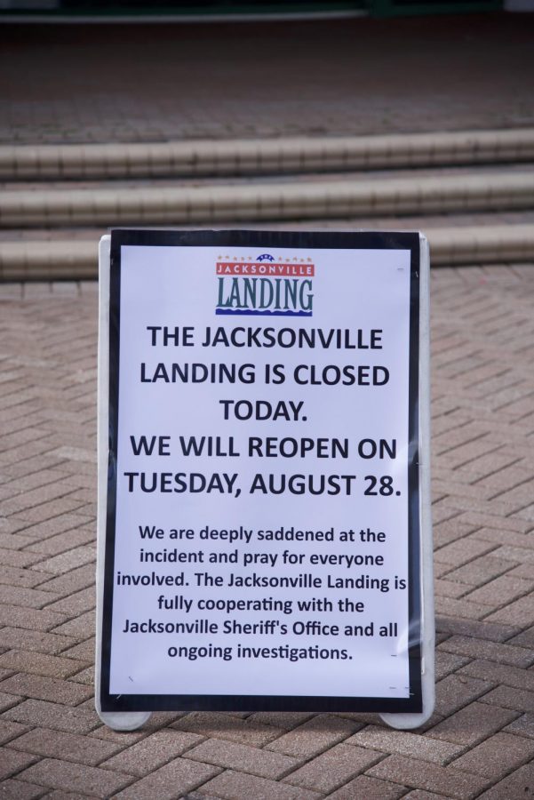 Sign posted outside The Landing announcing reopening for Tuesday, August 28.