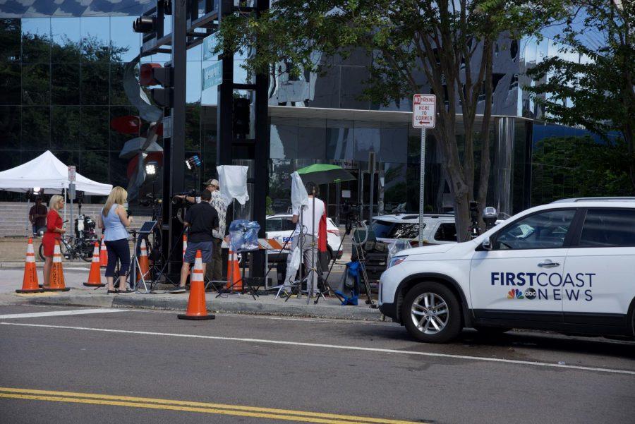 Local news sources line the street outside The Landing.