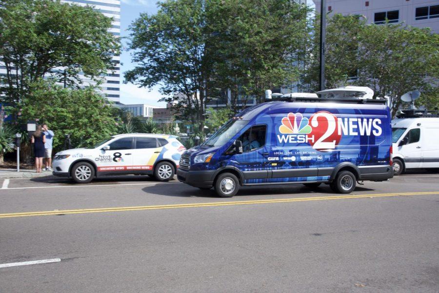 Local news line up outside The Landing.