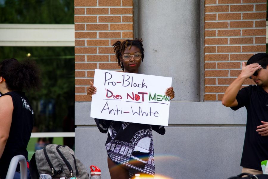 Attendee holding sign.