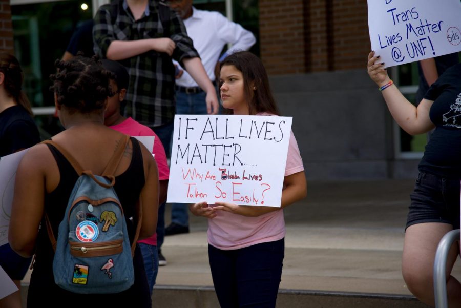 Attendee holding sign.