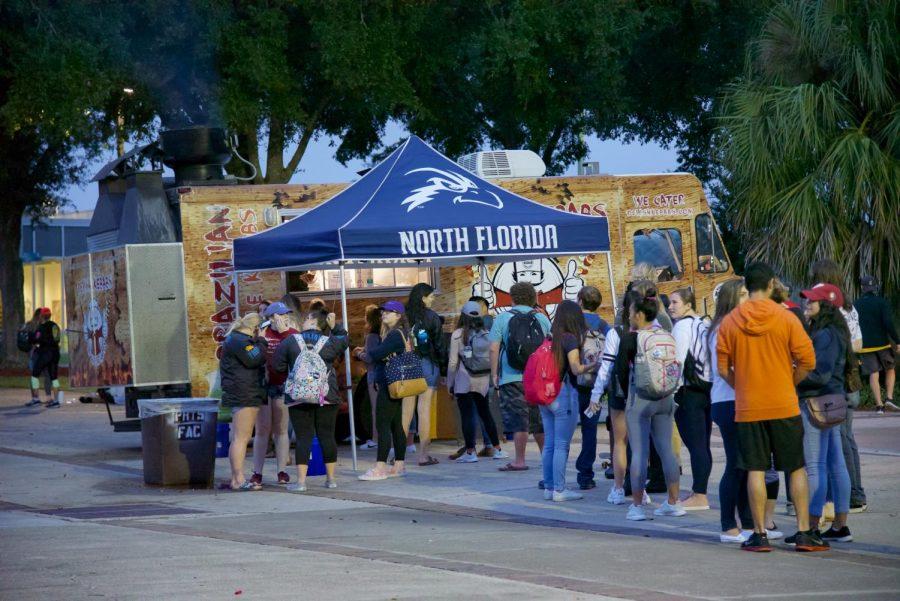 Students waiting in line for food at Party in the Plaza event.